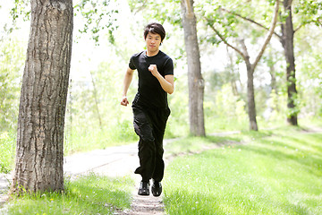 Image showing Portrait of man running in a park