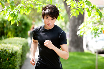 Image showing Serious man jogging