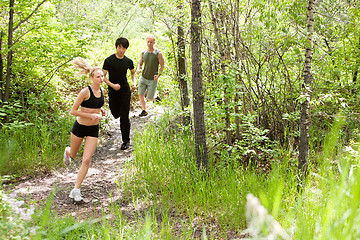 Image showing Friends running in the forest