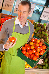 Image showing Grocery Store Clerk with Tomatoes