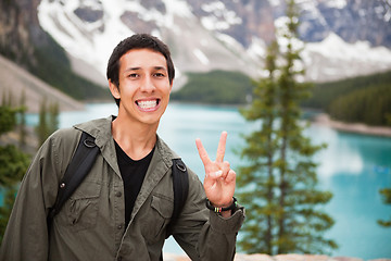 Image showing Male hiker showing you the 'V' sign