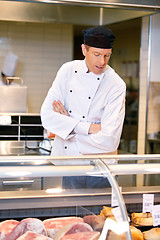 Image showing Butcher at Meat Counter