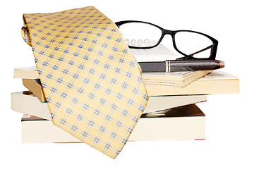Image showing Pen, lens, pile of books and tie 