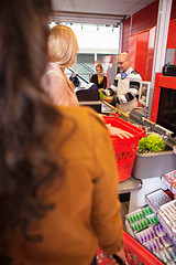 Image showing Shop assistant with customers