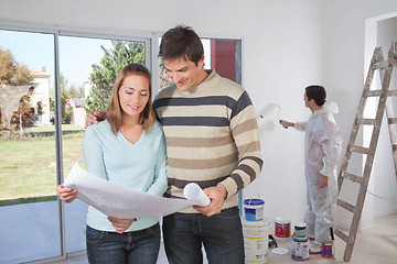 Image showing Couple going through house plan