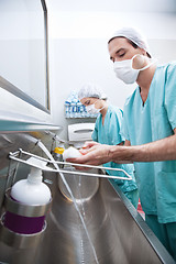 Image showing Man and woman washing hands