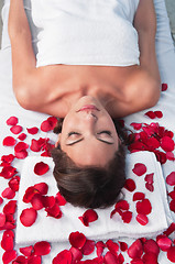 Image showing Relaxed woman lying on a massage table