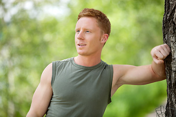 Image showing Man smiling and looking away