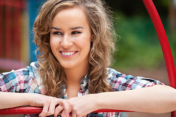 Image showing Happy young female looking away