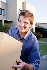 Image showing Moving Man with Box