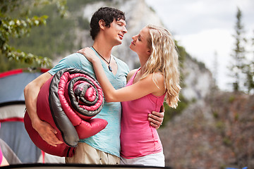 Image showing Romantic couple with sleeping bag while camping