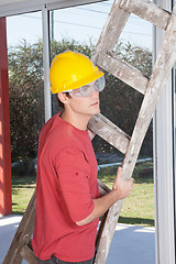 Image showing Male construction worker with a ladder