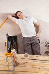 Image showing Thoughtful man on the floor