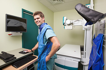 Image showing Radiologist examining  X-ray of dog's spine