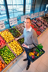 Image showing Portrait of a man buying fruits