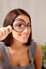 Image showing Woman with Magnifying Glass