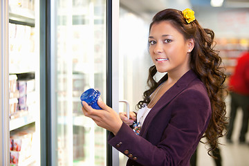 Image showing Woman by Grocery Store Fridge