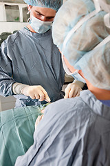 Image showing Surgeons operating on patient