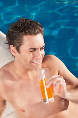 Image showing Handsome man by the poolside