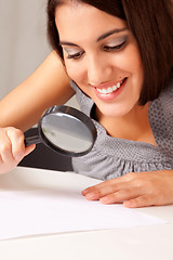 Image showing Woman with Magnifying Glass