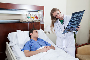 Image showing Doctor showing report to the patient