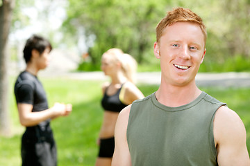 Image showing Portrait of a man with friends in the background