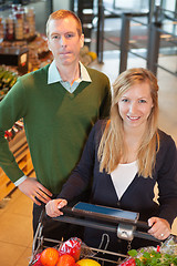 Image showing Happy Couple Buying Groceries