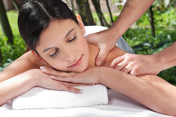 Image showing Attractive Caucasian woman getting massaged