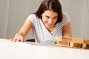 Image showing Architect Examining Model