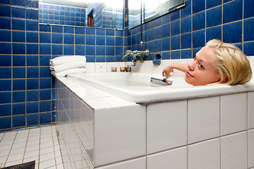 Image showing Woman in Bathtub in Blue Room