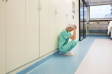 Image showing Upset surgeon sitting alone