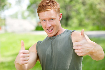 Image showing Man showing thumbs-up sign