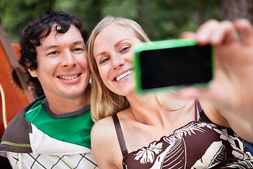 Image showing Young cheerful couple photographing themselves