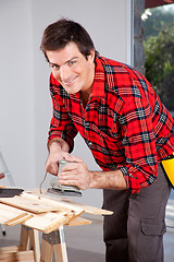 Image showing Man with Electric Hand Sander