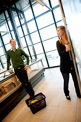 Image showing Flirting Couple in Supermarket