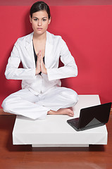 Image showing Businesswoman doing yoga