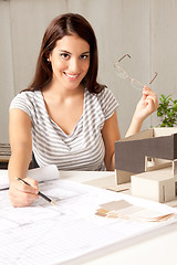 Image showing Architect with Blueprints and House Model