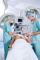 Image showing Patient being operated by the surgeons