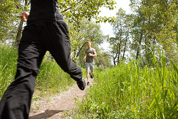 Image showing Friends jogging in forest