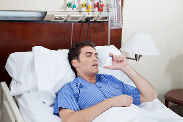 Image showing Patient using asthma inhaler