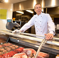 Image showing View of frozen meat with cheerful chef