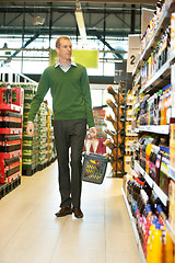 Image showing Man walking in grocery store