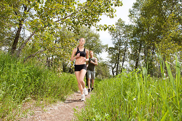 Image showing People in sportswear jogging