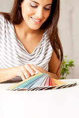 Image showing Woman looking at Color Swatches