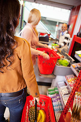 Image showing Customers carrying basket while shopping