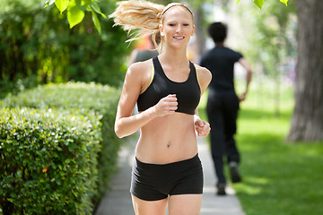 Image showing Portrait of a woman jogging