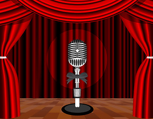 Image showing A microphone on a stage with a spotlight on it.