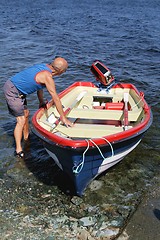 Image showing Man with a boat