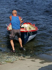 Image showing Man with a boat