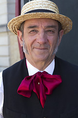 Image showing A man with a straw hat.